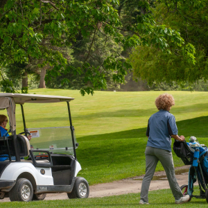 Golfers walking the course at Redstone Resort in the Kootenays